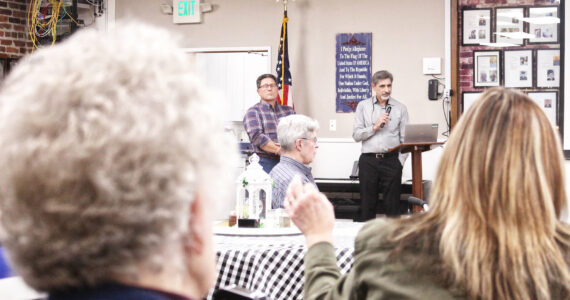Enumclaw Mayor Jan Molinaro, other city staff members and city councilmembers fielded questions about the proposed community center during a March 14 open house. Photo by Ray Miller-Still