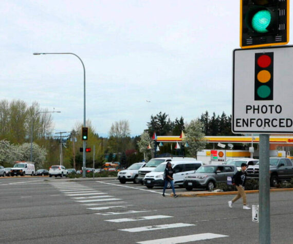 A red-light camera sign at Pacific Highway South and Kent Des Moines Road in Kent. File photo