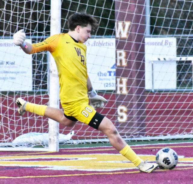 Goalkeeper Karsen Trudgeon launches a kick downfield after making a stop during the first half of the Hornets’ 3-0, Friday night victory over the visiting Fife Trojans. A larger photo is below. Photo by Kevin Hanson