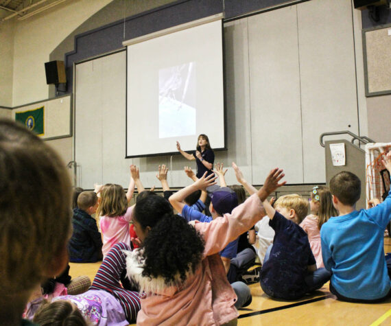 <p>Photo by Ray Miller-Still</p>
                                <p>Former astronaut Dr. Tammy Jernigan speaking at White River School District’s Mountain Meadow Elementary school about her time in space. </p>