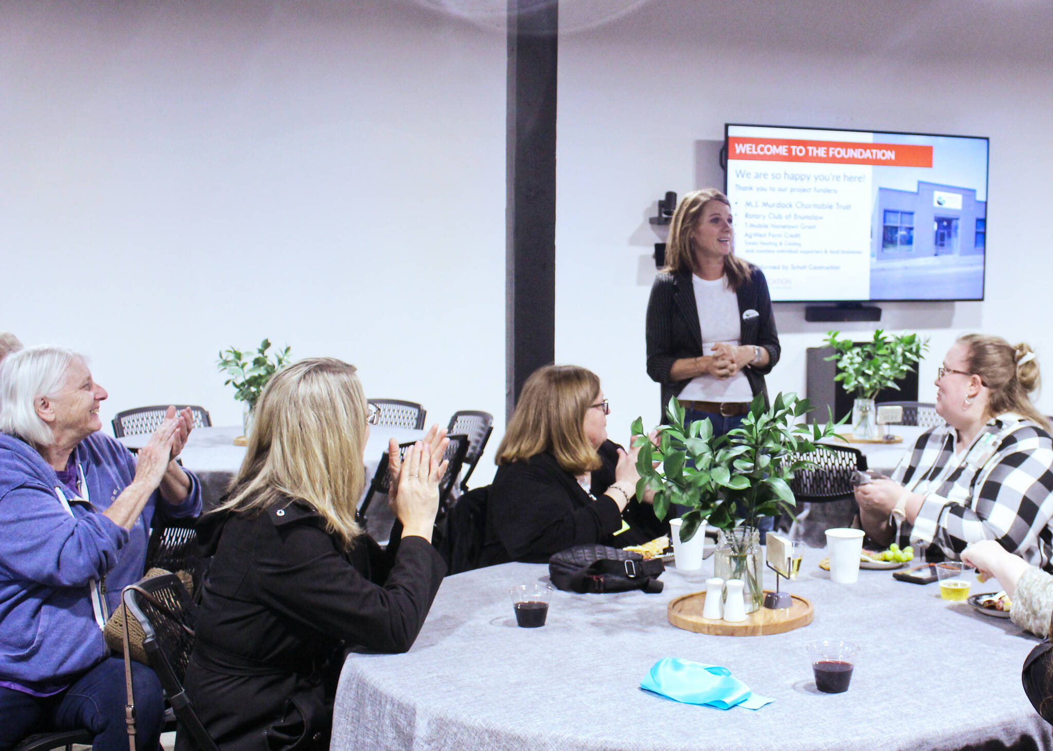 Rainier Foothills Wellness Foundations Executive Director Sara Stratton giving a warm welcome to her guests at the nonprofits new location on Griffin Avenue. Photo by Ray Miller-Still