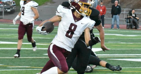 FILE PHOTO BY KEVIN HANSON 
White River senior Ray Palmer will have the opportunity to shine on both sides of the ball this fall. In this photo from a season ago he picks up yardage after a reception.
