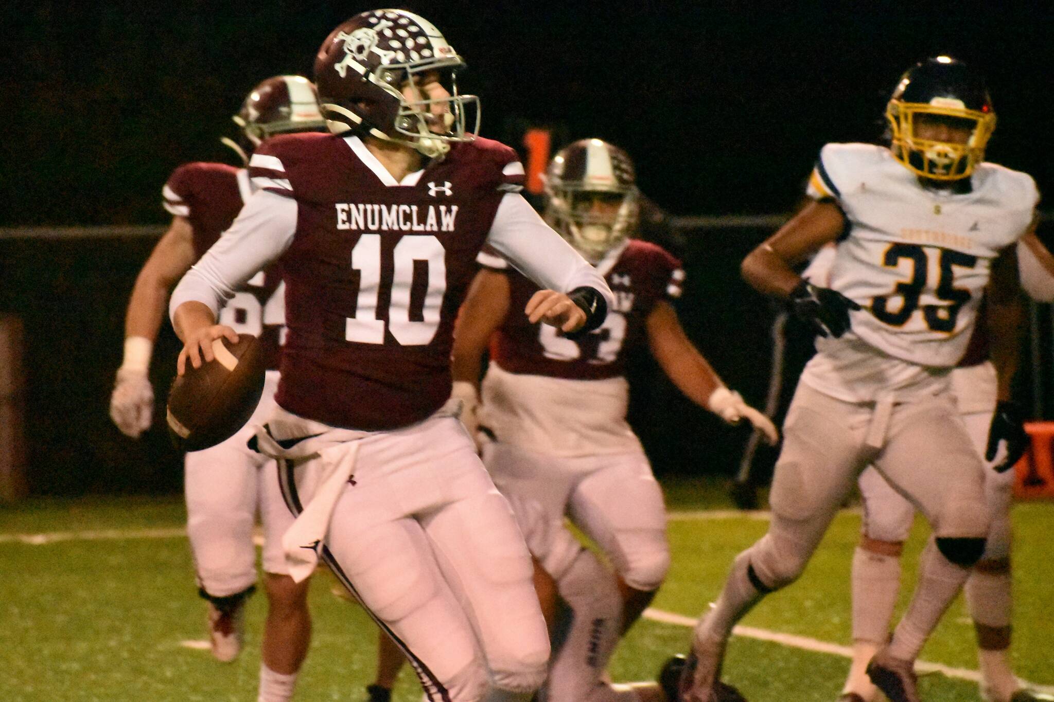 FILE PHOTO BY KEVIN HANSON 
Enumclaw quarterback Gavin Trachte looks for an open receiver during a game last fall. Now a senior, he is back to direct the Hornet offense.
