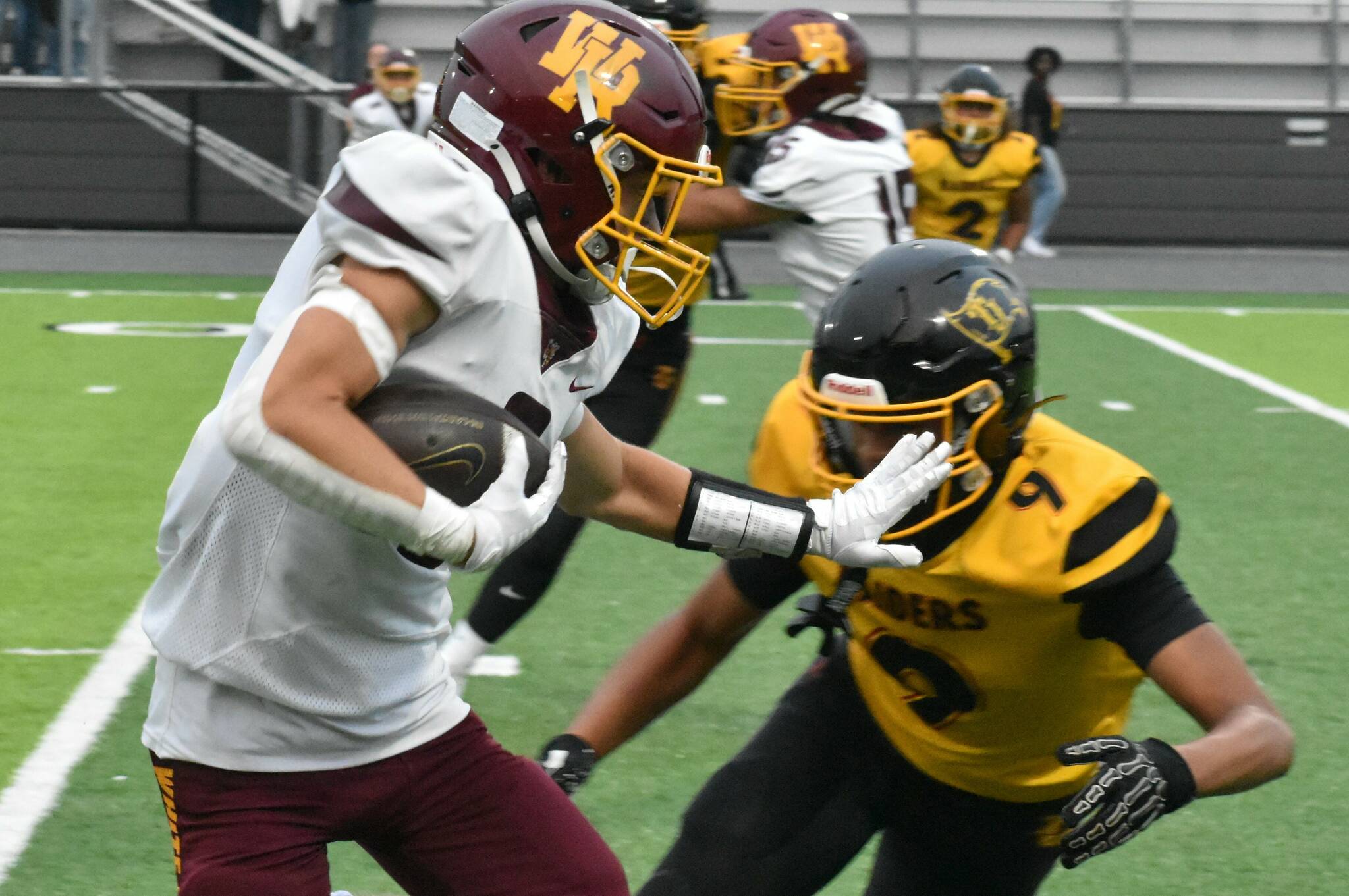 PHOTO BY KEVIN HANSON 
White River running back Mason Locke looks to avoid a Raider tackler during Friday nights Hornet victory.