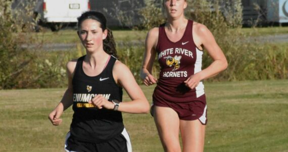Returning to Enumclaw’s cross country team is senior Lillian Haas; unfortunately for White River, Vivian Kingston, also pictured, graduated last year. Photo by Kevin Hanson