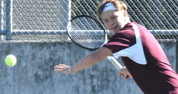 PHOTO BY KEVIN HANSON William Stuenkel, pictured here during an early-season match, has been one-half of Enumclaw’s successful No. 1 doubles team, pairing with King Gisa.