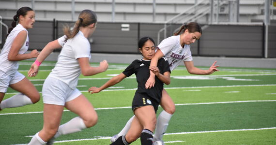 Kaihea Tuifua fights through contact against Enumclaw. Ben Ray / The Mirror