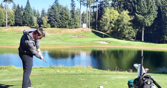 PHOTO COURTESY RYAN PICINICH Cole Kiblinger tees off at the par-3, 16th hole during last week’s North Puget Sound League 3A tournament at Gold Mountain.