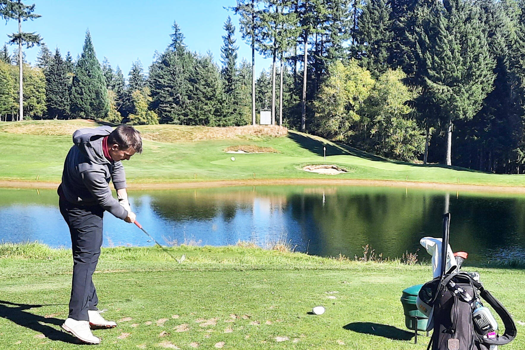 PHOTO COURTESY RYAN PICINICH Cole Kiblinger tees off at the par-3, 16th hole during last week’s North Puget Sound League 3A tournament at Gold Mountain.