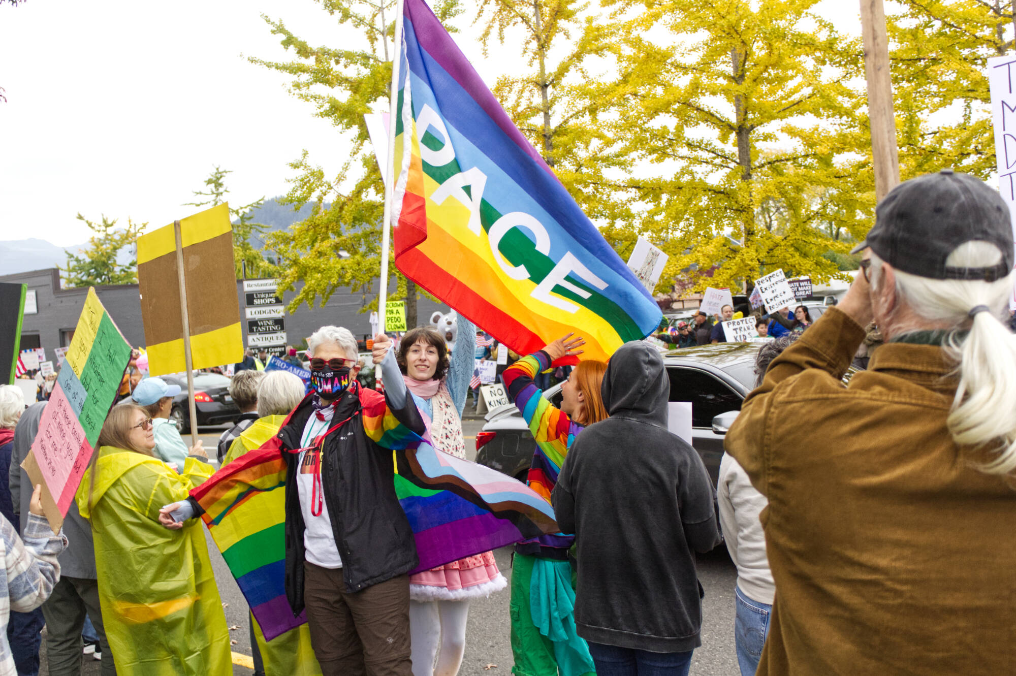 Pro-LGBTQ signs and attire were a common theme at the protest. Photo by Ray Miller-Still