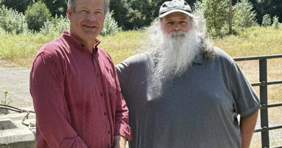 Photo by Drew Dotson/Renton Reporter
King County Council Vice Chair Reagan Dunn (left) and Bob Baker of Save the Cedar River (right) stand in front of the lot that will no longer be the site of an asphalt plant near the Cedar River. Instead, Dunn hopes to turn it into a public park for land preservation.