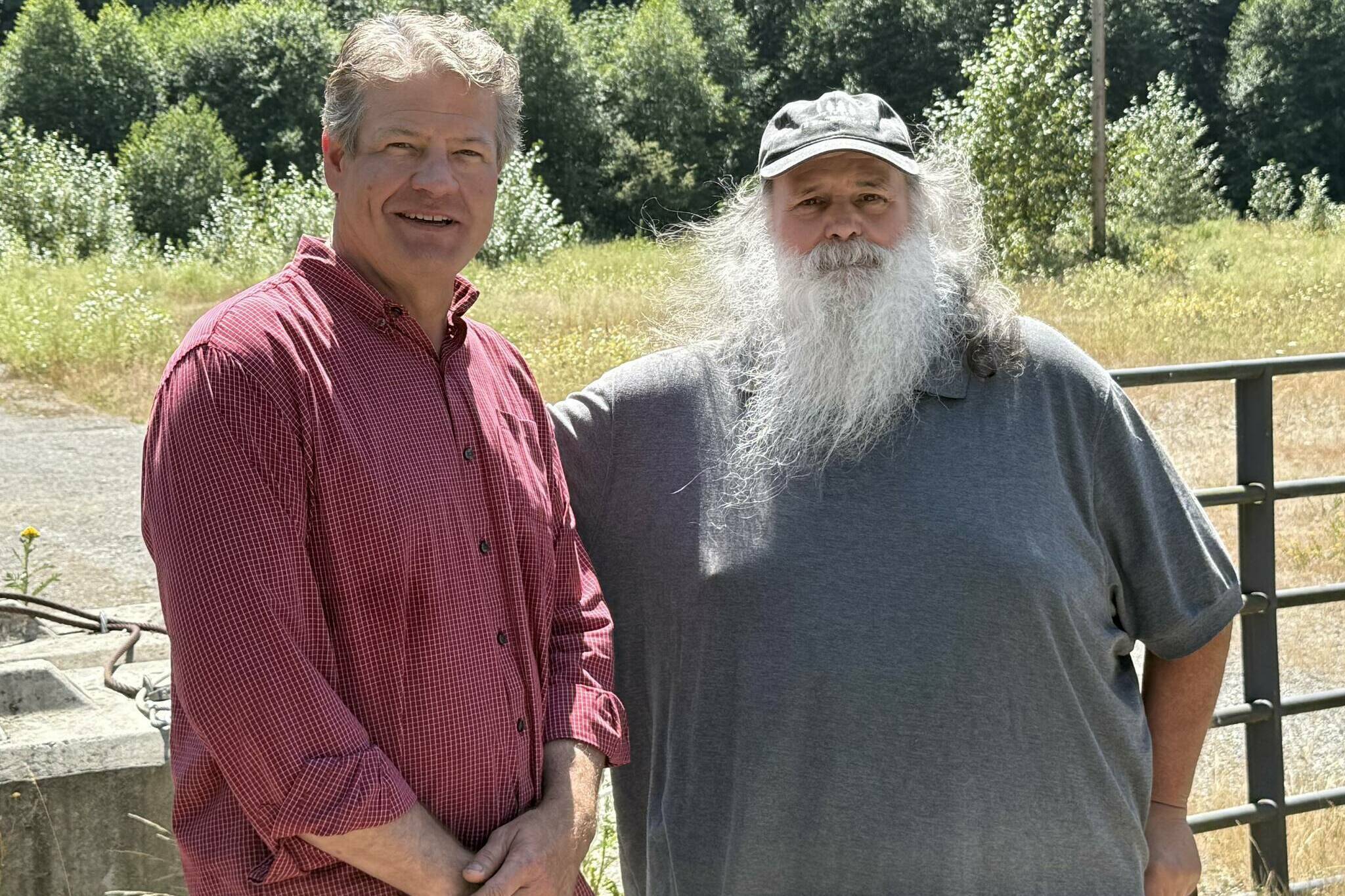 Photo by Drew Dotson/Renton Reporter
King County Council Vice Chair Reagan Dunn (left) and Bob Baker of Save the Cedar River (right) stand in front of the lot that will no longer be the site of an asphalt plant near the Cedar River. Instead, Dunn hopes to turn it into a public park for land preservation.