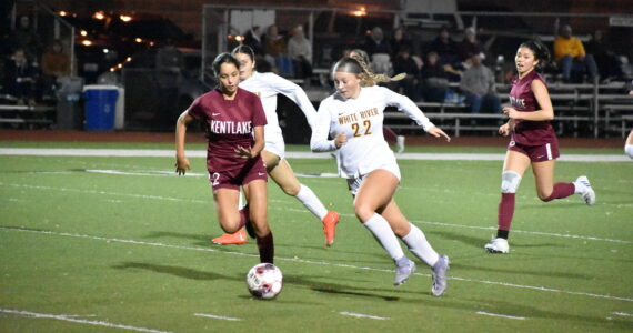 Jordyn Daigle and Isabella Cabaccang chase the ball for Kentlake and White River. Ben Ray / Sound Publishing