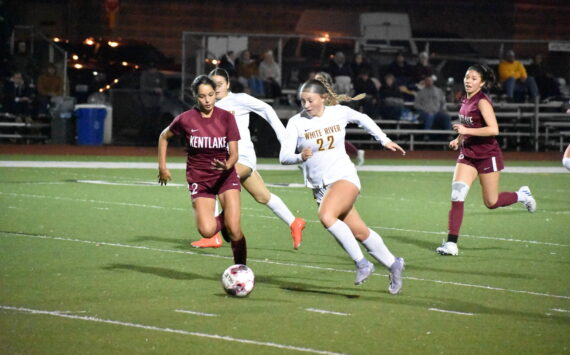 Jordyn Daigle and Isabella Cabaccang chase the ball for Kentlake and White River. Ben Ray / Sound Publishing
