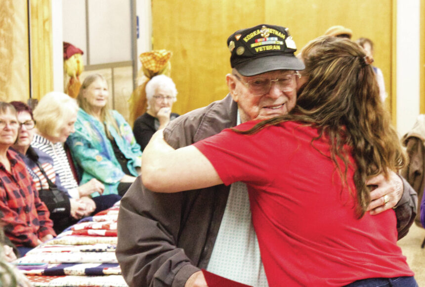 <p>Photos by Ray Miller-Still</p>
                                <p>Steve Bigger, a Vietnam War veteran, received not just a quilt, but a thank-you hug from Enumclaw Senior Center Recreation Coordinator Rochelle Rogers.</p>