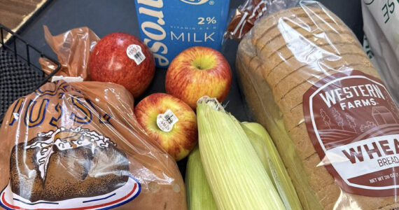 This example of a SNAP bag contains bread, potatoes, corn, apples, and milk; the bags can be picked up at the Rainier Fresh Country Store in Buckley. Photo courtesy Rainier Fresh Country Store