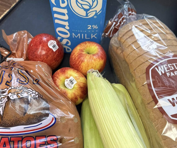 This example of a SNAP bag contains bread, potatoes, corn, apples, and milk; the bags can be picked up at the Rainier Fresh Country Store in Buckley. Photo courtesy Rainier Fresh Country Store