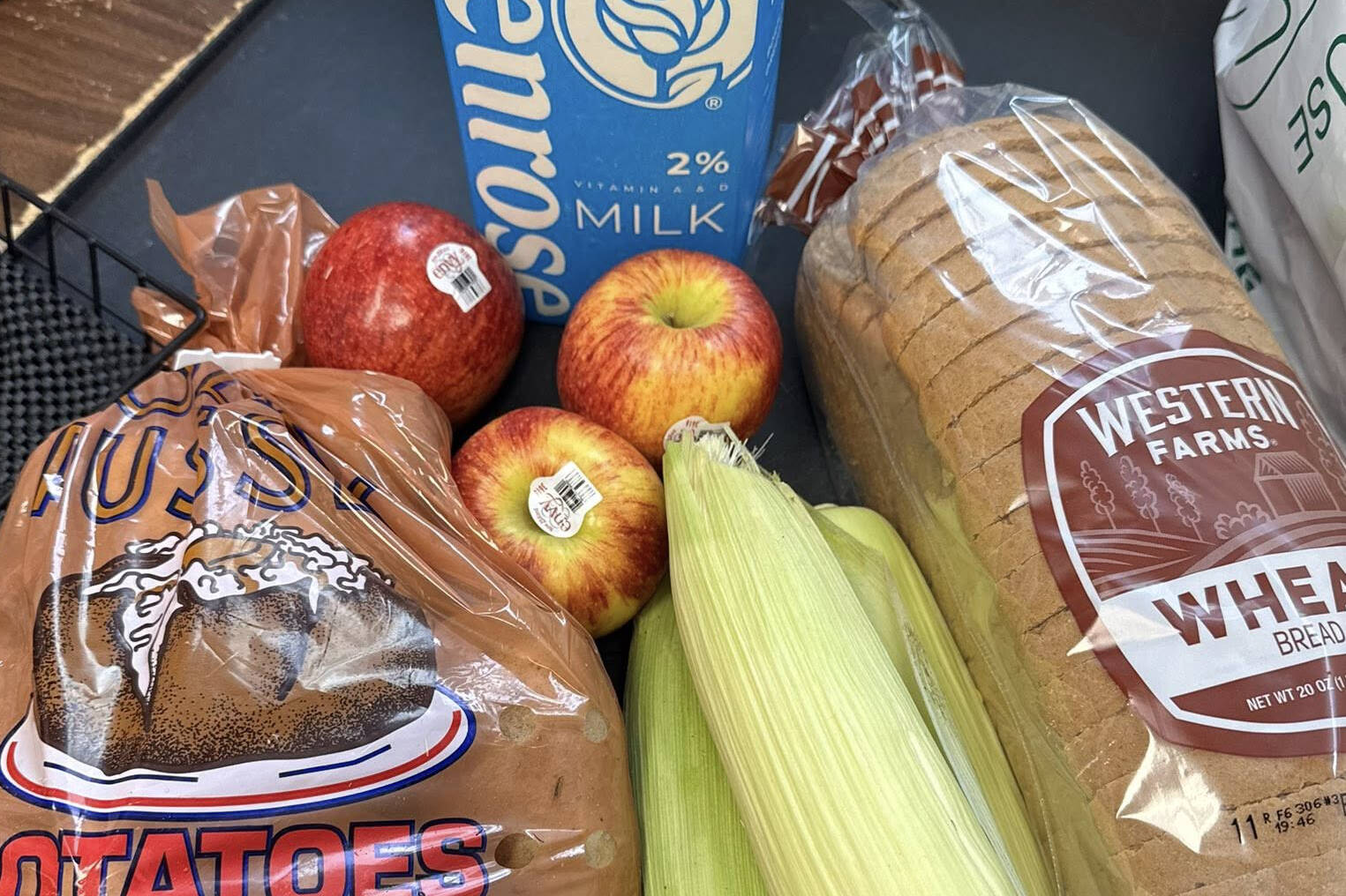 This example of a SNAP bag contains bread, potatoes, corn, apples, and milk; the bags can be picked up at the Rainier Fresh Country Store in Buckley. Photo courtesy Rainier Fresh Country Store