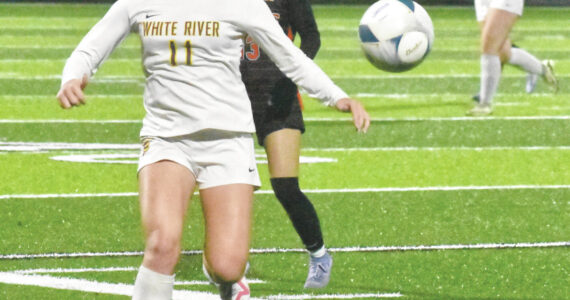 PHOTOs BY KEVIN HANSON 
Belle Knauss, a senior defender for White River, looks to corral a loose ball during the Hornets’ Thursday night playoff game.