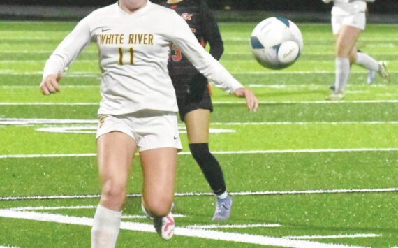 PHOTOs BY KEVIN HANSON 
Belle Knauss, a senior defender for White River, looks to corral a loose ball during the Hornets’ Thursday night playoff game.