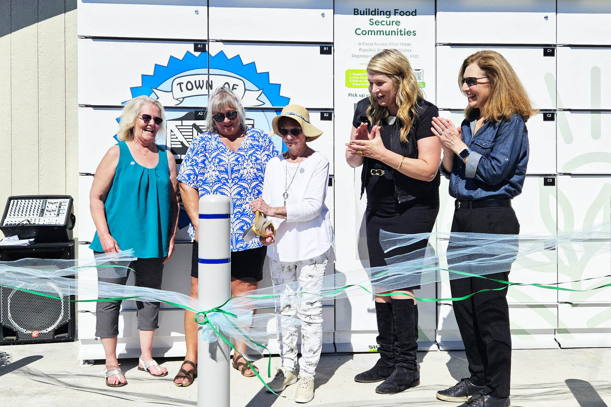 GoodRoots Northwest opened a refrigerated food locker in Carbonado in September 2024. Pictured here is Kyllonen, 90, who was the citys longest volunteer at the local pantry. Also pictured, left to right, is Shelly Wright and Denise Vesey, co-founders of the food pantry, GoodRoots CEO Stacey Crnich, and Congressional Rep. Dr. Kim Schrier. Photo by Ray Miller-Still