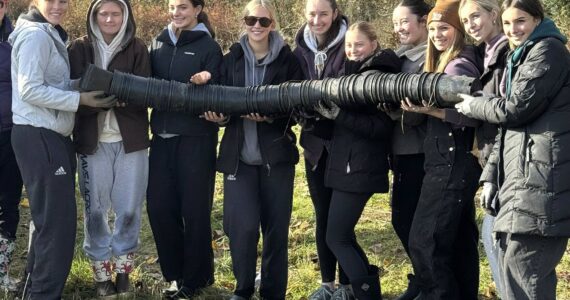 SUBMITTED PHOTO
Members of the Enumclaw High volleyball program helped plant trees along the banks of South Prairie Creek, part of an ongoing restoration project. From left are Emma Holt, Berkley Kahne, Ava Smith, Halle Martel, Natalie Patten, Reagan Nelson, Malia Williamson, Ella Webley, Kaylee Wall, and Carolyn Megargle.