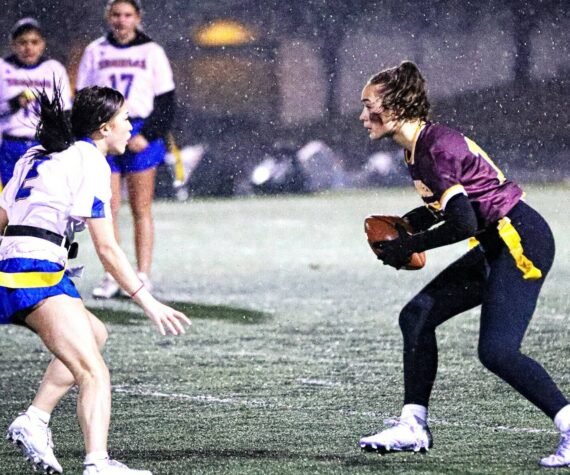 PHOTO COURTESY STEPHANIE FINDLEY 
Enumclaw High quarterback Madison Holden looks for an open receiver while avoiding a Tahoma defender during the Hornets’ first flag football game.