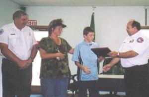 Helping burned victim earns awards for two