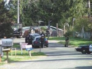 SWAT team arrests a murder suspect