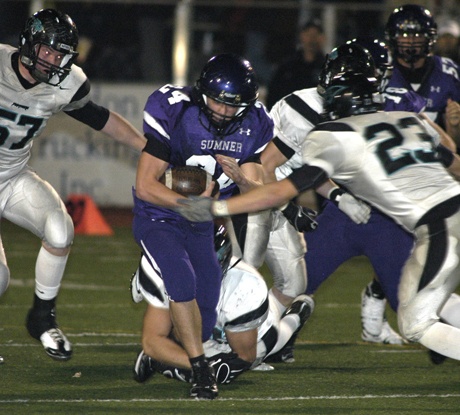 Sumner's Tyler Salisbury runs through the Bonney Lake defense for a short gain.