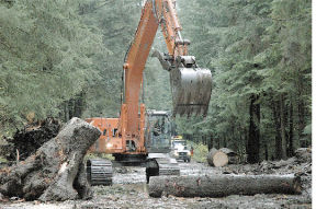 Department of Transportation crews worked  feverishly to get state Route 410 east of Enumclaw open again after a slide closed the road.