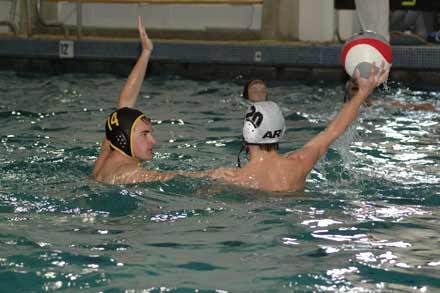 Alex Stopsack defends against Auburn Riverside during the Hornets' home opener.