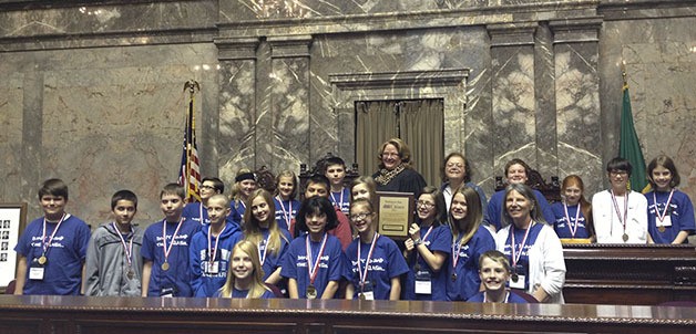 Carbonado students and teacher Signe Lukasiak gathered Saturday for a group photo in Olympia. The women in center back are Supreme Court Justice Mary Fairhurst (in dark robe) and Kathy Hand