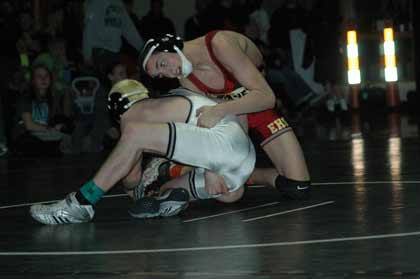 Enumclaw's Tyke Reid got the upper hand on Bonney Lake's Andrew Cunningham during Saturday's regional tournament finals.