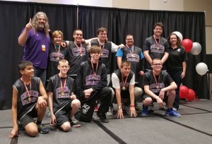 Keith Ross with his team; back row