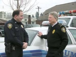 Chaplain Art Sphar speaks with Sgt. Matt Kurle outside the Sumner police station.  Sphar is a chaplain for Bonney Lake and Sumner Police departments. Photo By Dennis Box.