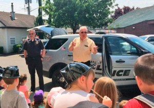Police Chief Brad Moericke and Mayor Enslow welcome a school group to the Police Department.