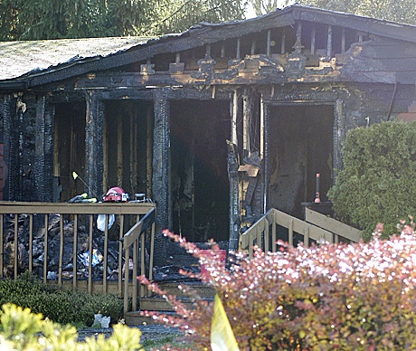 Investigators remained on site to determine the cause of an early morning fire Nov. 18 in a Buckley-area mobile home in Mount Rainier Heights.