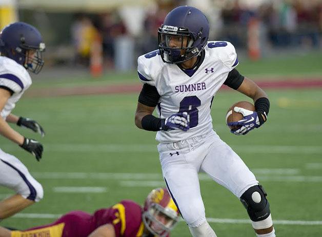 Senior wide receiver Triston Wedington looks down field as he carries the ball Friday against Enumclaw. The Spartans won 48-17.