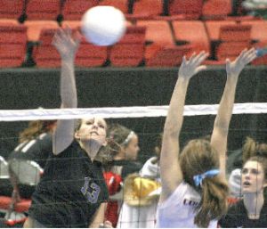 Sumner High junior Sidney Erickson goes high for a kill against Holy Names Academy