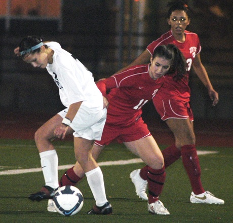 Beverly Kobe (2) battles a Kennedy player for possession of the ball during the first half of the Panthers' 1-0 shootout win Nov. 4 at Sunset Chev Stadium in Sumner.