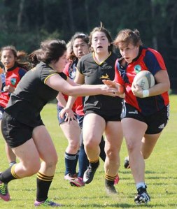 Hannah Lewandowski shows her skill in rugby.
