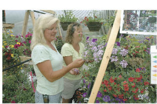 Rebecca Frisby gets help from Tammi Hoylman