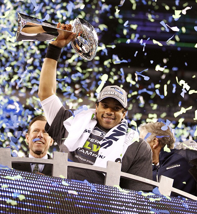 Seattle Seahawks quarterback Russell Wilson celebrates the first Super Bowl victory Sunday.