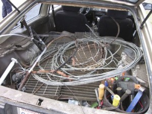 A trooper conducted a traffic stop for a seatbelt violation ans saw several steel grates and pieces of metal in the back seat.