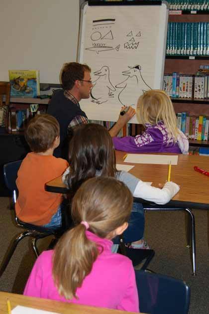 Illustrator Erik Brooks gives Black Diamond Elementary students a quick lesson.