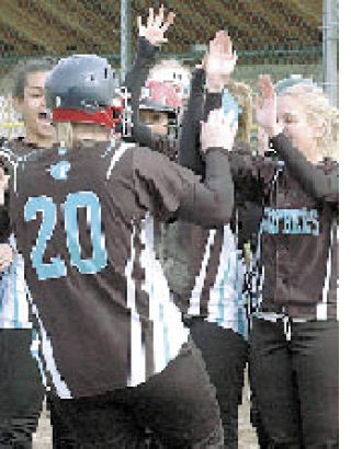 Caitlin Colvin is greeted after her second-inning home run.