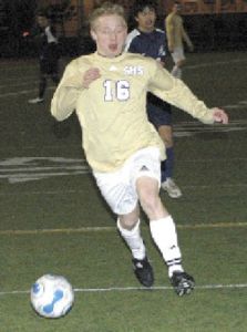 Sumner High’s Brandon Denny takes the ball downfield during a Spartan victory over the Lakes Lancers.