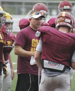 Enumclaw High football coach Mark Gunderson worked with the team Thursday as the Hornets prepare for the 2013 season.