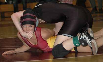 Enumclaw's Maranda Long and White River's Sam Lovelace tangle during Hornet-Hornet action Jan. 6.
